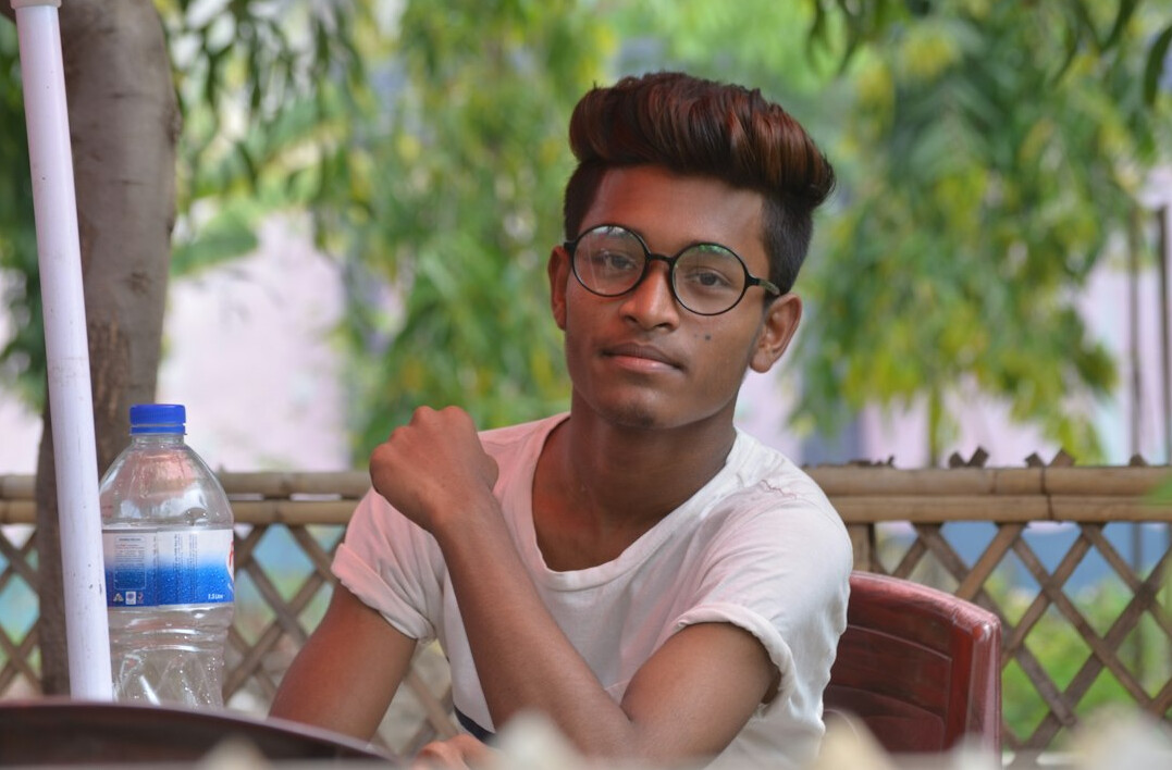 Portrait of a young man with glasses smiling